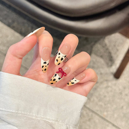 Hand-painted gradient French manicure with leopard print and three-dimensional bowknot