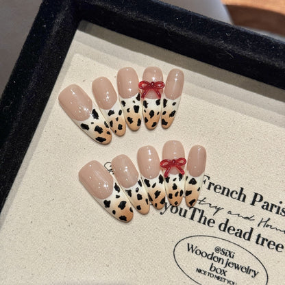 Hand-painted gradient French manicure with leopard print and three-dimensional bowknot