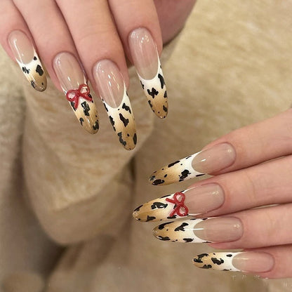 Hand-painted gradient French manicure with leopard print and three-dimensional bowknot