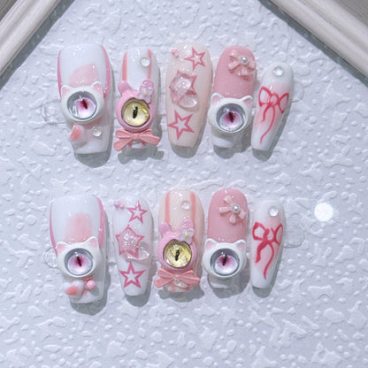 Handmade press-on nails. New style little devil nail art with three-dimensional monster eyes