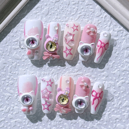 Handmade press-on nails. New style little devil nail art with three-dimensional monster eyes